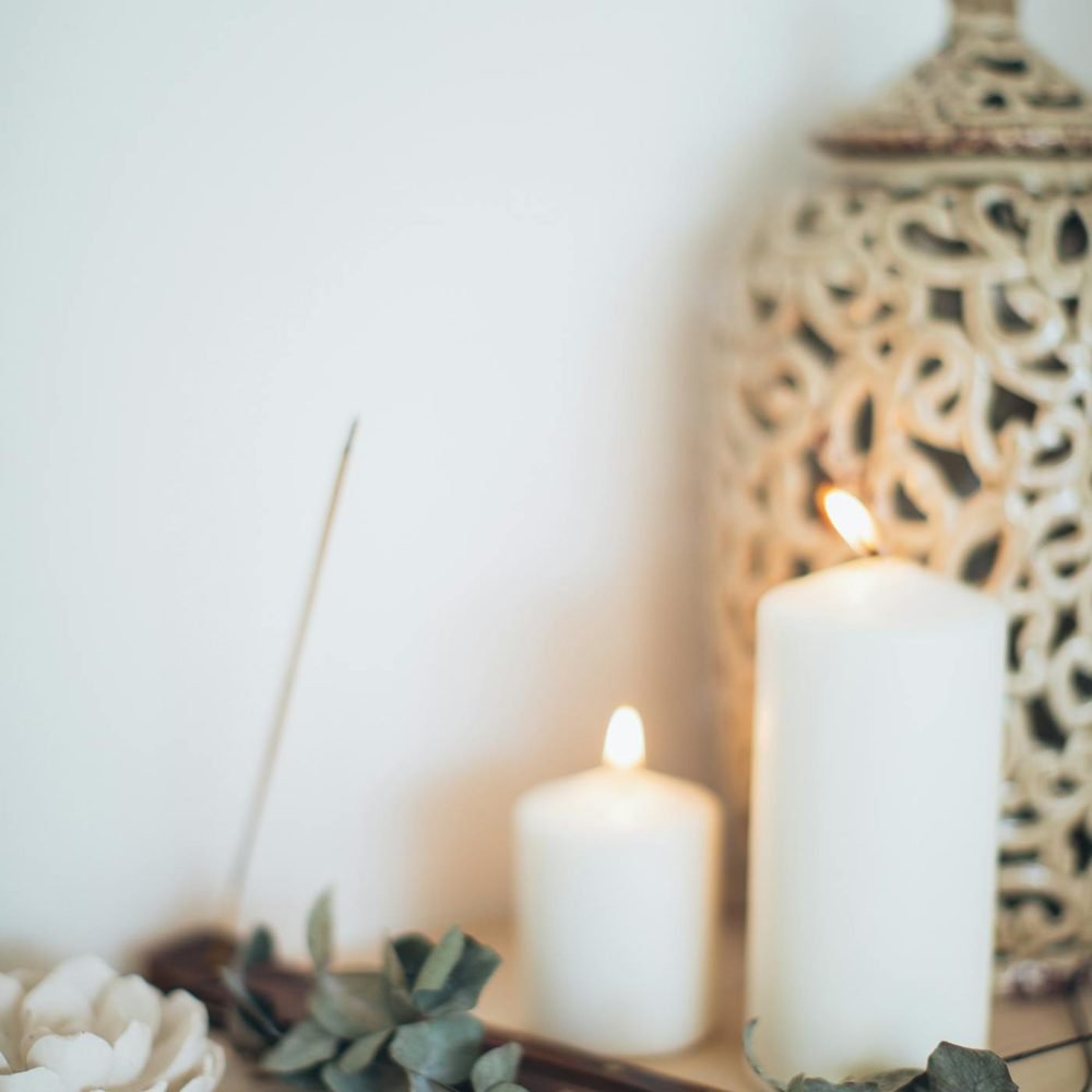 Calm spa-like still life with candles and eucalyptus