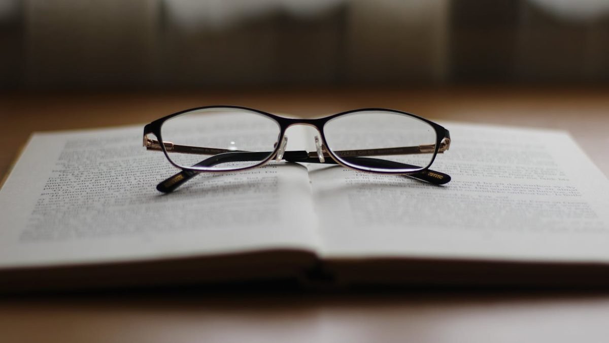 Open book and reading glasses